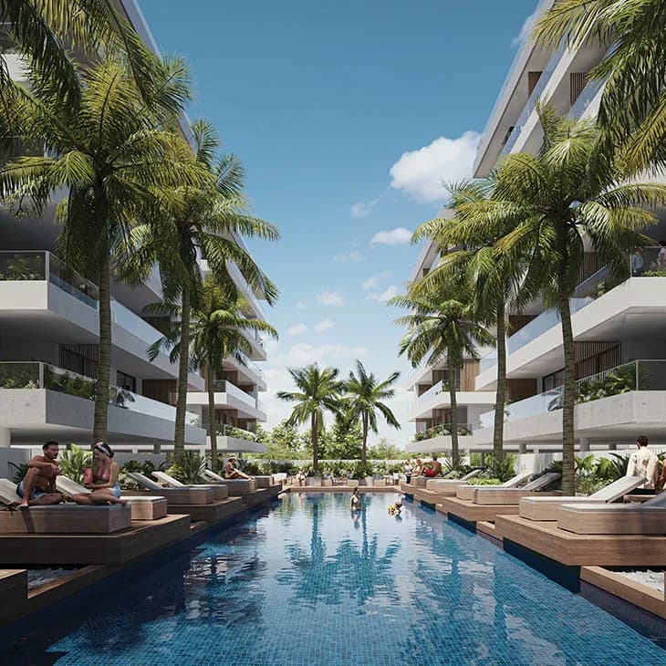 The pool at Luna Residences, with palms and residents