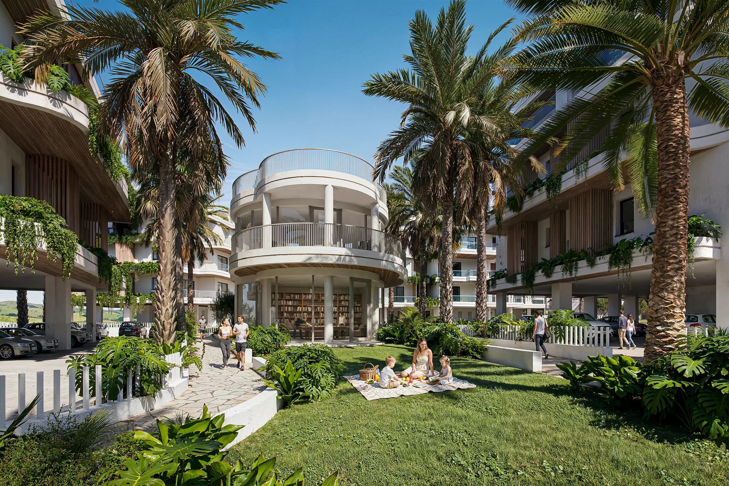 The clubhouse at Zin Residences, among palms and lawn