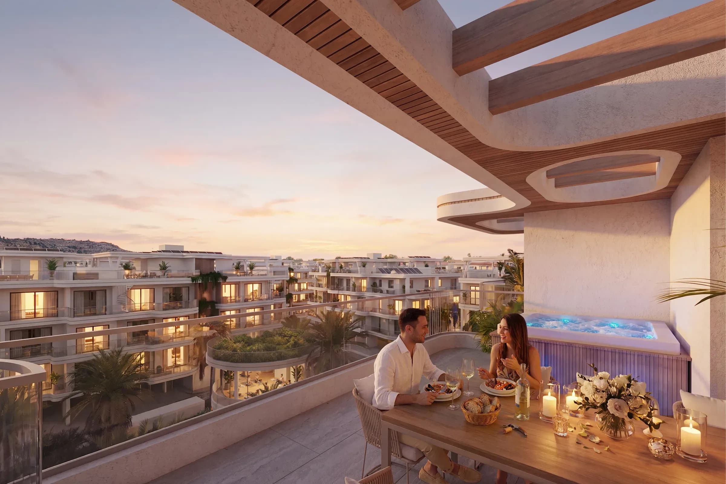 A private terrace at Zin Residences at dusk, laid for dinner